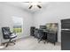 Home office with desk, chair, and large window at 13031 Pacific Nighthawk Ave, Weeki Wachee, FL 34614