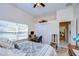 Bright bedroom with a workspace and direct access to the bathroom at 8704 Cypress Lakes Blvd, New Port Richey, FL 34653
