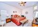 Large main bedroom with a king-size bed and plenty of natural light at 8704 Cypress Lakes Blvd, New Port Richey, FL 34653