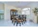 Elegant dining room with a large glass-front china cabinet at 8704 Cypress Lakes Blvd, New Port Richey, FL 34653