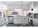 Bright kitchen features granite countertops, stainless steel appliances, and ample cabinet space at 10316 Amadeus Dr, Port Richey, FL 34668