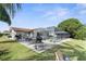 Spacious backyard with pool, patio, and grill at 10316 Amadeus Dr, Port Richey, FL 34668