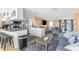 Open living area with comfortable seating, large TV, and kitchen views at 10316 Amadeus Dr, Port Richey, FL 34668