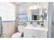 Classic bathroom features updated vanity and neutral tile at 10316 Amadeus Dr, Port Richey, FL 34668
