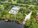 Aerial view of WatersEdge community amenities including pool and lake access at 11231 Belle Haven Dr, New Port Richey, FL 34654