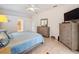 Spacious bedroom with large bed, dresser, and TV at 11281 Godwit Ave, Weeki Wachee, FL 34613