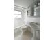 Clean bathroom with pedestal sink and shower/tub combo at 15473 Darien Way, Clearwater, FL 33764