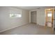 Bright bedroom with a closet and window at 15473 Darien Way, Clearwater, FL 33764