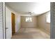 Spacious bedroom with ceiling fan and large window at 15473 Darien Way, Clearwater, FL 33764