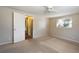 Bright and airy bedroom with neutral carpeting and large window at 15473 Darien Way, Clearwater, FL 33764