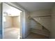 Spacious bedroom closet with built-in shelving at 15473 Darien Way, Clearwater, FL 33764