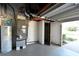 Garage with HVAC unit, water heater, and storage at 15473 Darien Way, Clearwater, FL 33764