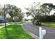 Quiet residential street with mature trees at 15473 Darien Way, Clearwater, FL 33764