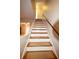 Clean and bright staircase leading to the second floor at 15473 Darien Way, Clearwater, FL 33764
