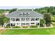 Clubhouse back view, showcasing expansive patio and landscaping at 6392 Summit View Dr, Brooksville, FL 34601