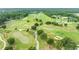 Aerial view of a scenic golf course with homes in the background at 6392 Summit View Dr, Brooksville, FL 34601