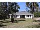 Stunning backyard featuring a lush lawn, a variety of trees and ample space for outdoor activities at 6392 Summit View Dr, Brooksville, FL 34601