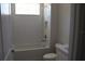 Bathroom with white subway tile surround, a shower/tub combo and a recessed wall niche at 6392 Summit View Dr, Brooksville, FL 34601