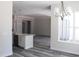 Open concept kitchen featuring white cabinets, stainless appliances and center island with seating at 6392 Summit View Dr, Brooksville, FL 34601