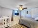 Bedroom with double bed and crib, near closet at 7310 Rockwood Dr, Port Richey, FL 34668