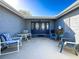 Inviting front entry with a covered patio and seating area at 7310 Rockwood Dr, Port Richey, FL 34668