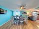 Dining room features a six-seat table, wood floors, and a kitchen pass-through at 7310 Rockwood Dr, Port Richey, FL 34668