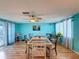 Bright dining room with wood floors and a table for six at 7310 Rockwood Dr, Port Richey, FL 34668
