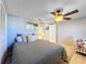 Bedroom with double bed and crib, near closet at 7310 Rockwood Dr, Port Richey, FL 34668