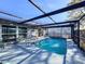 Inviting screened pool with patio furniture at 7310 Rockwood Dr, Port Richey, FL 34668