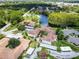 Aerial view showing community layout and lake at 7719 Cosme Dr # 1, Hudson, FL 34667