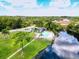 Community pool with lake view and lounge area at 7719 Cosme Dr # 1, Hudson, FL 34667