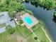 Community pool area with lake access at 7719 Cosme Dr # 1, Hudson, FL 34667