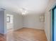 Bedroom with wood-look floors and bathroom access at 7719 Cosme Dr # 1, Hudson, FL 34667