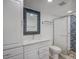 Bathroom with updated vanity and beautiful tiled shower at 7719 Cosme Dr # 1, Hudson, FL 34667