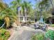 Shared patio area with tables and chairs for outdoor dining at 7719 Cosme Dr # 1, Hudson, FL 34667