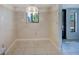 Empty dining area with tiled floor and access to outside at 7719 Cosme Dr # 1, Hudson, FL 34667