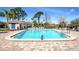 Inviting community pool with surrounding patio at 7719 Cosme Dr # 1, Hudson, FL 34667