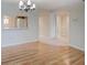 Bright living room with hardwood floors and a view of the kitchen and hallway at 7719 Cosme Dr # 1, Hudson, FL 34667