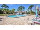 Refreshing community pool with patio seating at 7719 Cosme Dr # 1, Hudson, FL 34667