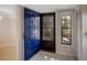 Inviting entryway with a blue front door and view of the backyard at 7719 Cosme Dr # 1, Hudson, FL 34667