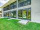 Ground level patio with sliding doors and access to a grassy backyard at 7719 Cosme Dr # 1, Hudson, FL 34667