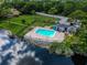 Community pool and patio area next to lake at 7719 Cosme Dr # 1, Hudson, FL 34667