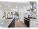 Modern kitchen with stainless steel appliances and a stylish backsplash at 9035 Glen Moor Ln, Port Richey, FL 34668