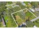 Aerial view highlighting property lot boundaries and surrounding homes at 9305 Kiowa Dr, New Port Richey, FL 34654