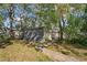 Detached garage with metal siding, located on a wooded lot at 9305 Kiowa Dr, New Port Richey, FL 34654
