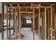 Home undergoing reconstruction, with exposed framing and electrical work at 9305 Kiowa Dr, New Port Richey, FL 34654