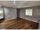 Spacious living area with gray walls and wood-look flooring at 9401 Bourbon St, New Port Richey, FL 34654