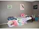 bedroom with twin bed and colorful decor at 7204 Westcott Dr, Port Richey, FL 34668