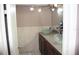 Bathroom with double sinks and a separate shower at 7204 Westcott Dr, Port Richey, FL 34668