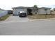Single-story house with a driveway and garage at 7204 Westcott Dr, Port Richey, FL 34668